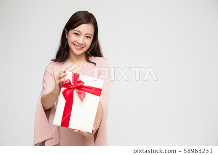Happy beautiful asian woman smile with gift box Happy beautiful asian woman smile with gift box 58963231