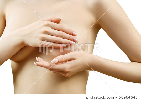 Naked woman examining her breast. Naked woman examining her breast. 58964645