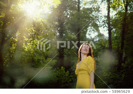 Portrait Of Redhead Young Woman Smiling With Sun Flare Portrait Of Redhead Young Woman Smiling With Sun Flare 58965629