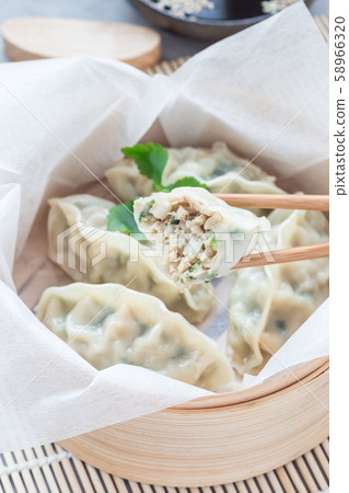 Steamed Korean dumplings Mandu with chicken meat Steamed Korean dumplings Mandu with chicken meat 58966320