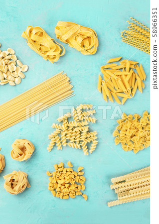 Italian pasta variety, flat lay banner, overhead shot on a blue background 58966351