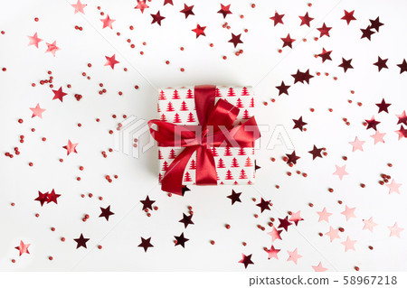 Christmas present with red bow on white background Christmas present with red bow on white background 58967218
