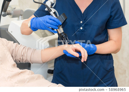 Laser Skin Rejuvenation on female arms and hands Laser Skin Rejuvenation on female arms and hands 58968965