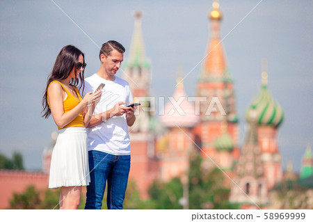 Happy young urban woman in european city. Happy young urban woman in european city. 58969999
