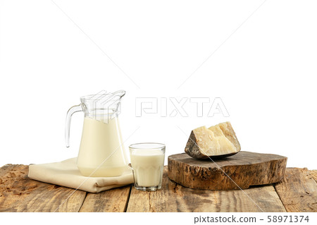 Different milk products, cheese, cream, milk on wooden table and white background. Different milk products, cheese, cream, milk on wooden table and white background. 58971374