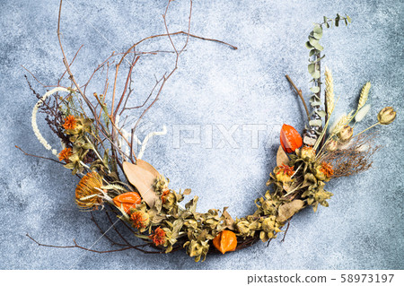Autumn wreath made of dried flowers. 58973197