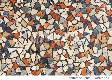 Mosaic flooring of multicolored small stones 58973634
