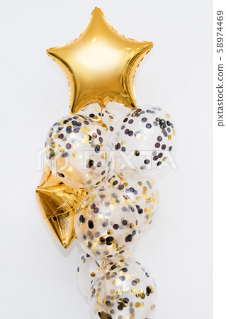 Metallic gold helium balloons of different shapes Metallic gold helium balloons of different shapes 58974469
