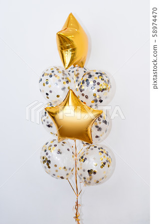 Metallic gold helium balloons of different shapes 58974470