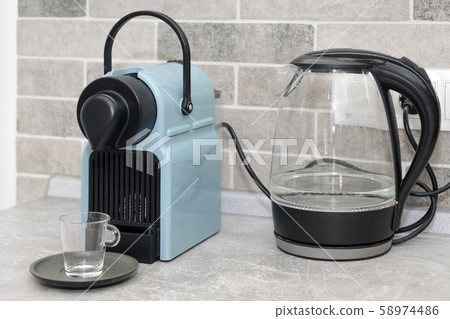 Coffee machine and electric kettle in the kitchen 58974486