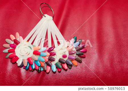Palette with different swatches of nail polish. Palette with different swatches of nail polish. 58976013