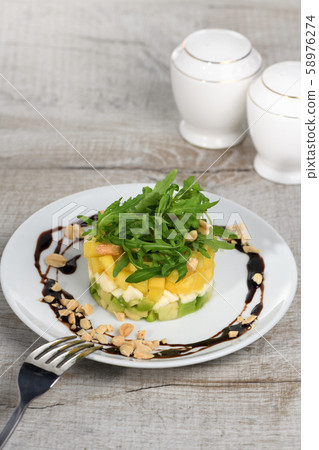 Salad with avocado, mango and mozzarella 58976274