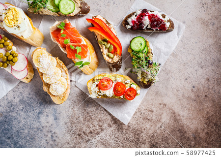 Open toasts with different toppings Open toasts with different toppings 58977425