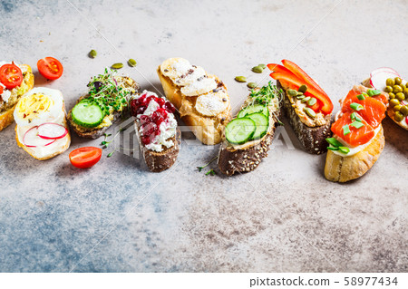 Open toasts with different toppings Open toasts with different toppings 58977434