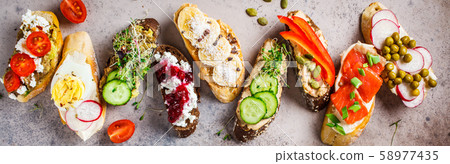 Open toasts with different toppings Open toasts with different toppings 58977435