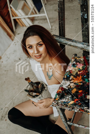 Female artist hand holding paintbrush Female artist hand holding paintbrush 58978184