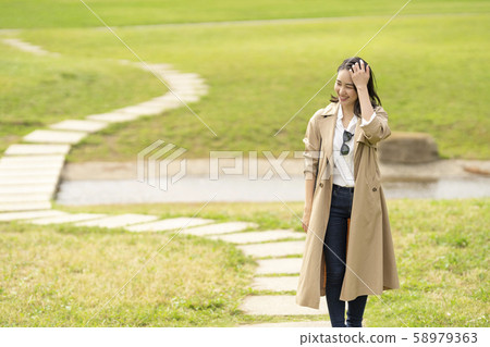 Cool woman in trench coat 58979363