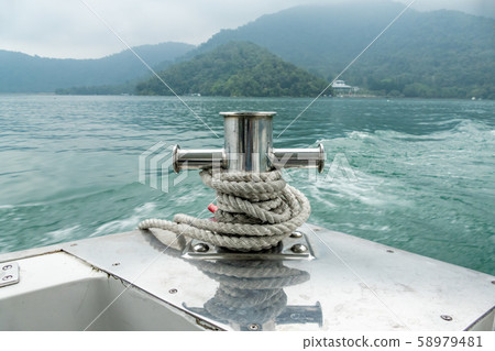 Mooring post on small boat on beautiful green 58979481
