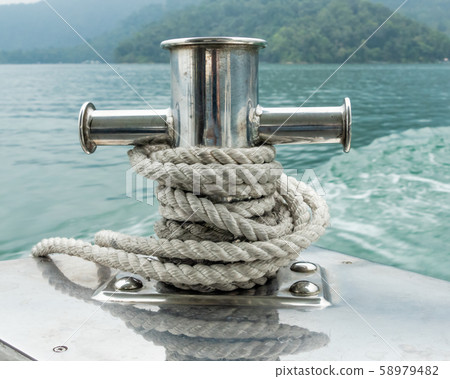 Mooring post on small boat on beautiful green 58979482