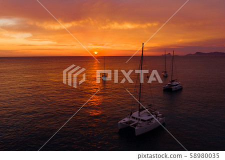 Aerial view from drone on boats shipping in sea, sunset 58980035