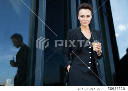portrait of a successful businesswoman on the background of a skyscraper 58982520
