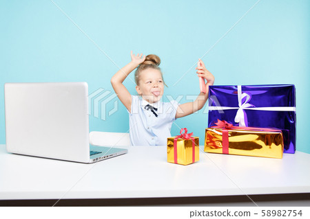 New Year blog concept. Little blogger making video on the phone about gifts isolated. 58982754