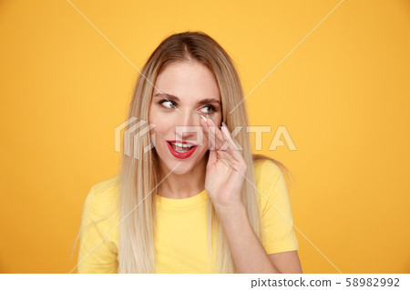 Gorgeous girl announcing in the yellow studio. Gorgeous girl announcing in the yellow studio. 58982992