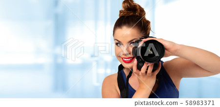 Woman shoots photos Woman shoots photos 58983371