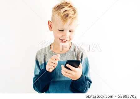 .teenager boy with phone 58983702