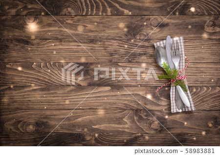 Christmas table place setting with linen napkin on 58983881
