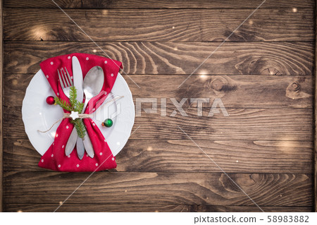 Christmas table place setting with red and white Christmas table place setting with red and white 58983882