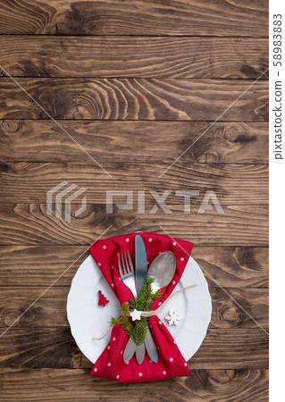 Christmas table place setting with red and white Christmas table place setting with red and white 58983883