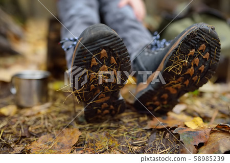 Little boy scout during hiking in autumn forest. 58985239
