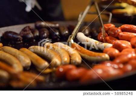 Hot food on Tallinn Christmas fair. Sausages Hot food on Tallinn Christmas fair. Sausages 58985248