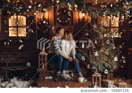 Christmas portrait of a romantic couple wooden Christmas portrait of a romantic couple wooden 58985326