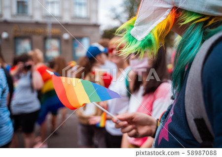 Happy crowd waving lgbt flags during Pride Parade Happy crowd waving lgbt flags during Pride Parade 58987088