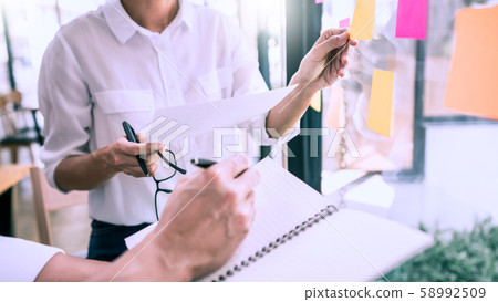 Business people meeting at office and use sticky Business people meeting at office and use sticky 58992509
