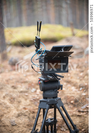 Camera is standing in the middle of the autumn forest Camera is standing in the middle of the autumn forest 58996971