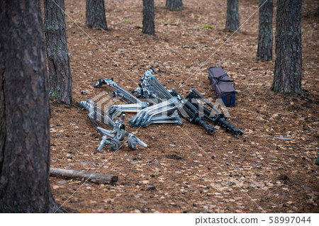 Movie equipment is lying on autumn leaves 58997044