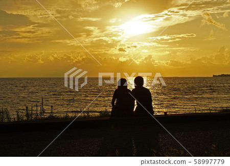 Man and woman by the lake Man and woman by the lake 58997779