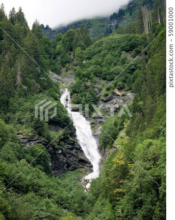 Silver waterfall in the Weissstannen Valley, a famous waterfall in Eastern Switzerland (Sankt Gallen, Switzerland) Silver waterfall in the Weissstannen Valley, a famous waterfall in Eastern Switzerland (Sankt Gallen, Switzerland) 59001000