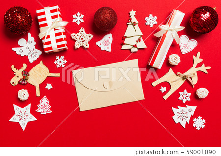 Top view of envelope on red background. New Year 59001090