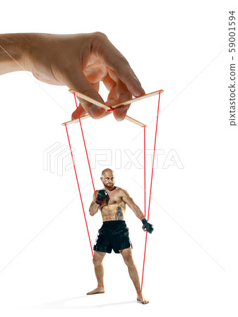 Man like a puppet in somebodies hands. Concept of manipulation Man like a puppet in somebodies hands. Concept of manipulation 59001594