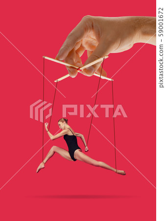 Woman like a puppet in somebodies hands. Concept of manipulation Woman like a puppet in somebodies hands. Concept of manipulation 59001672