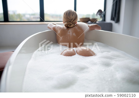 Woman with nice body chilling in foaming bath 59002110