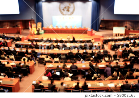 Blurred photo meeting.People meeting to share the ideas for peace.they are in hall on Thailand.peace,UN, Photo concept United and blurred photo. Blurred photo meeting.People meeting to share the ideas for peace.they are in hall on Thailand.peace,UN, Photo concept United and blurred photo. 59002163