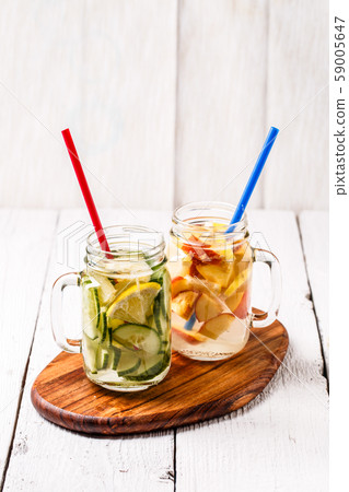 Two mugs of infused detox diet refreshing waters 59005647