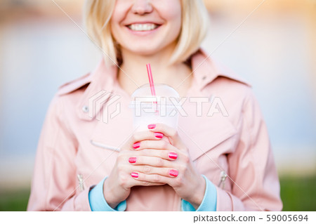Portrait of blonde with milkshake Portrait of blonde with milkshake 59005694