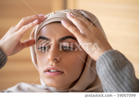 Portrait of Muslim girl dressing up in the morning Portrait of Muslim girl dressing up in the morning 59007099