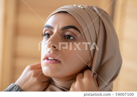 Portrait of Muslim woman getting ready Portrait of Muslim woman getting ready 59007100